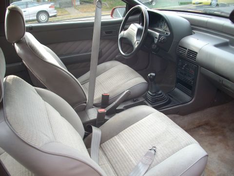 1989 Ford Probe - The interior of a 1989 Ford Probe shows its cloth seats and dashboard layout.