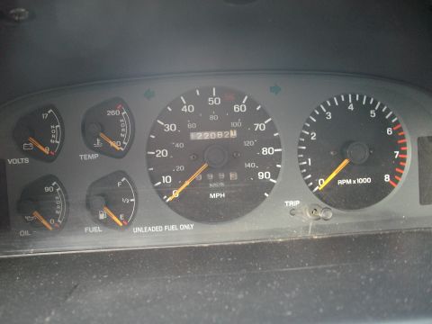 1989 Ford Probe - Interior view of dashboard gauges, including speedometer, tachometer, fuel, oil, temperature, and voltage meters.
