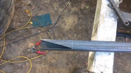 1978 Ford Bronco - A metal beam is shown with a precisely cut end, suggesting fabrication or repair work in progress.
