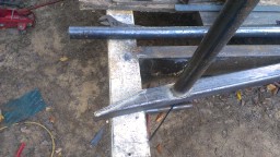 1978 Ford Bronco - Close-up of metal fabrication, showing welds on a tubular frame structure.