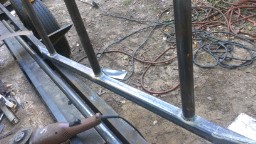 1978 Ford Bronco - A close-up view of a metal frame construction, showing welded joints and raw metal.