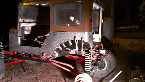 1978 Ford Bronco - Custom off-road vehicle body undergoing modifications with visible suspension parts.