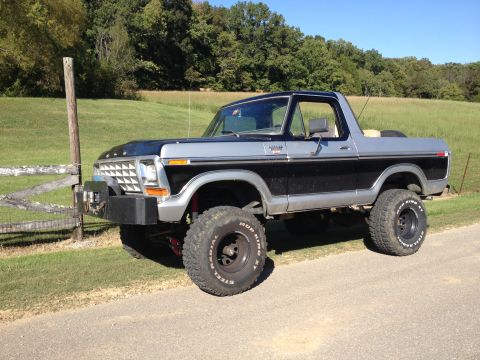 1979 Ford Bronco - This lifted 1979 Ford Bronco features a two-tone black and silver paint scheme and aggressive off-road tires.