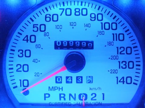 2003 Ford Crown Victoria - Blue-lit speedometer with odometer at 099999 about to roll over, PRND21 gear indicator
