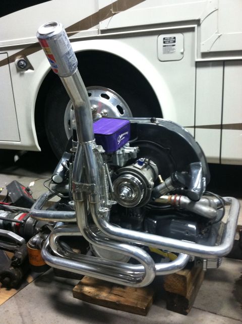 1970 Volkswagen Beetle - Custom exhaust system on a Volkswagen engine, with a beer can serving as an intake cover.