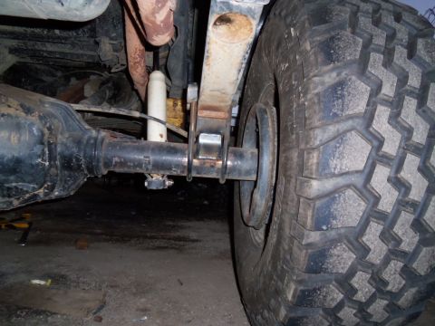 1989 Ford Bronco - The rear suspension components of a vehicle are visible in this close-up shot.