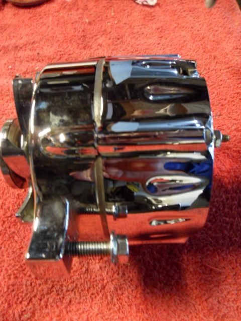 1994 Jeep Cherokee - Close-up of a chrome alternator part.