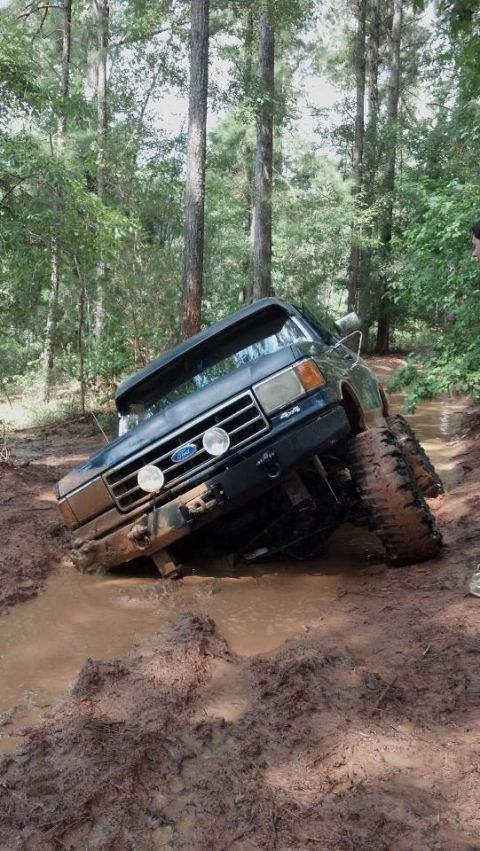1990 Ford Bronco - This 1990 Ford Bronco is stuck deep in the mud on a wooded trail.