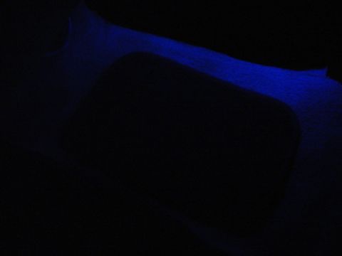 1999 Ford Taurus - Blue ambient lighting illuminates the floor area of a vehicle's interior.