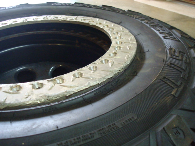 Close-up of a beadlock ring on a tire with visible bolt holes