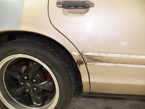 1993 Ford Crown Victoria - Found some rust near the right rear wheel well.