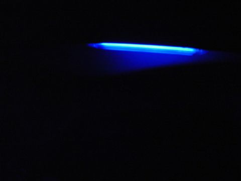 1999 Ford Taurus - A blue light strip is visible against a dark background, with "SUPERMOTORS" text at the bottom right.