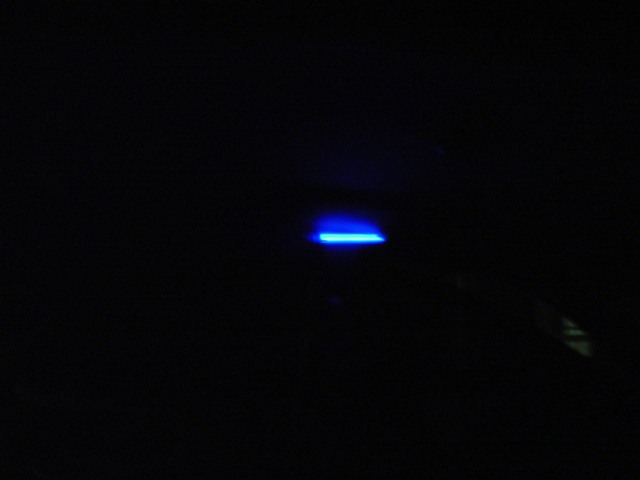 blue light glows in the dark with 'SUPERMOTORS' text at the bottom right