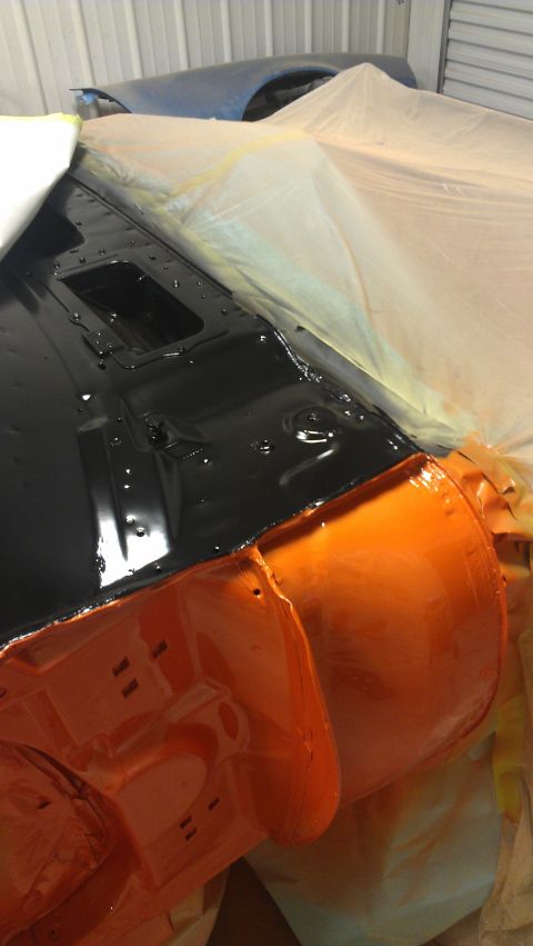 1973 Chevrolet Camaro - Car body parts are being prepped and painted in a workshop environment.