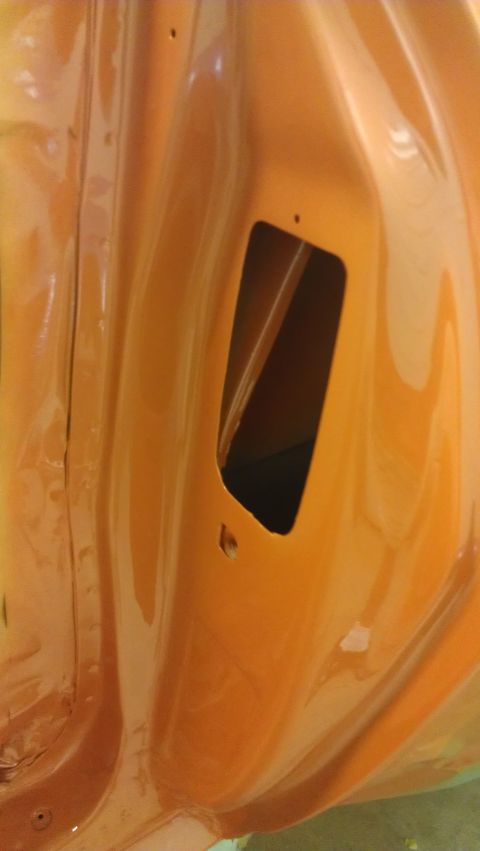 1973 Chevrolet Camaro - Interior view of an orange door jamb, likely from a 1973 Chevrolet Camaro, showing a rectangular opening.