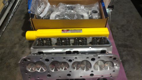 1973 Chevrolet Camaro - New engine parts are ready for installation, including cylinder heads and valve springs.