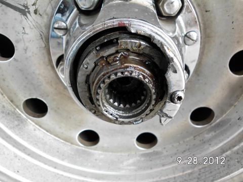 1994 Ford Bronco - Damaged wheel hub assembly shows wear and tear on the internal splines and outer casing.