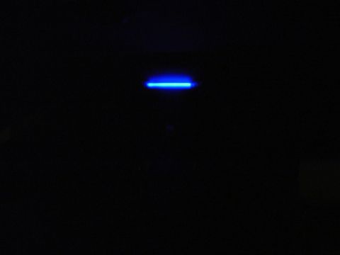 1999 Ford Taurus - A blue light strip is visible against a dark background, with a website logo in the corner.