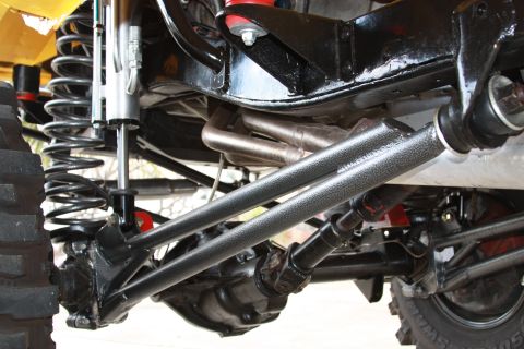1970 Ford Bronco - Detailed view of the modified suspension and drivetrain components of an off-road vehicle.