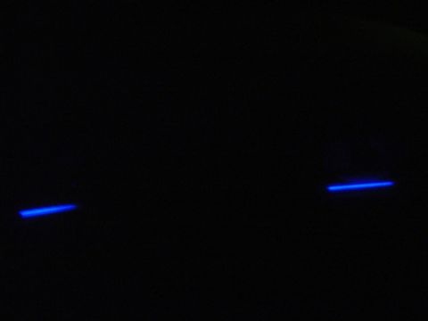 1999 Ford Taurus - Two blue light strips are visible on a black background, with the SUPERMOTORS website address printed at the bottom.