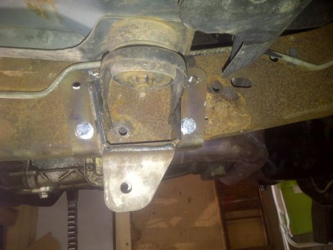 1995 Ford Bronco - This photo shows a close-up of a vehicle's frame with a custom-welded suspension bracket and mounting hardware.