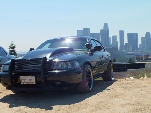 2003 Ford Crown Victoria - Lowered black Crown Victoria with custom wheels parked above downtown LA