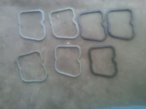 1980 Ford Bronco - Several rubber gaskets are laid out on a textured gray surface, with a SuperMotors logo visible at the bottom right.