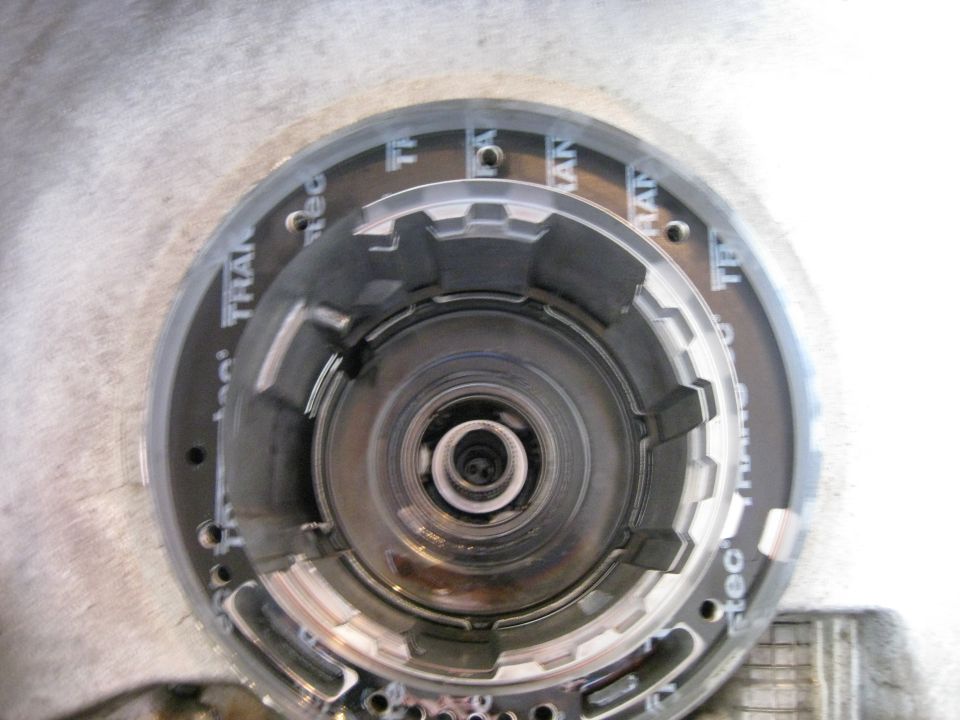 A snap ring holds the rest of the assembly in the housing.
