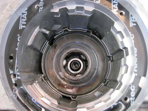 1994 Ford Bronco - Planetary gearset with snap ring removed. Note the anit-clunk spring located in the upper right between the planetary gearset and the case.