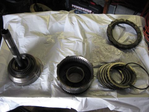 1994 Ford Bronco - From left to Right; Forward clutch Reverse clutch drum Reverse clutches Top Right: Intermediate clutches The reverse clutches and intermedi…
