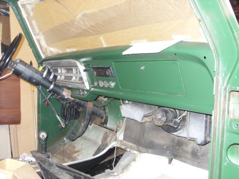 1967 Ford F-250 - The interior dashboard of a 1967 Ford F-250, showing the instrument cluster and radio.