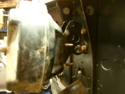 1967 Ford F-250 - Close-up view of a brake booster and associated mounting hardware on a vehicle's firewall.