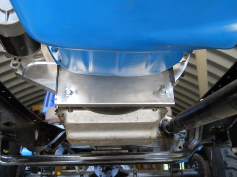 1992 Ford Bronco - Underside view of an engine component, showing the oil pan and a blue part with visible markings.
