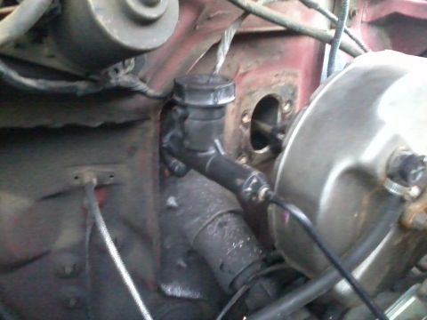 1981 Ford Bronco - Close-up view of the brake master cylinder and booster assembly.