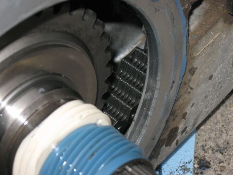 1981 Ford Bronco - Detail of internal gearing and chain drive, likely from a vehicle's drivetrain component.