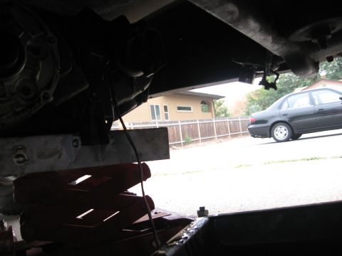 1981 Ford Bronco - Lowering the transfer case with the jack.