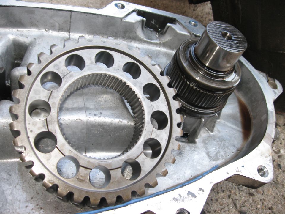 The chain has NO lateral movement in it, so once the clip is off, you have to slide both gears on the ends of the chain off at the same time. They come out in one piece.  After you do, the chain will have slack, and you can just pull the gears out.