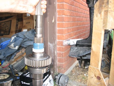 1981 Ford Bronco - A close-up view of a transmission input shaft, a large gear and blue banding, likely for a vehicle swap.