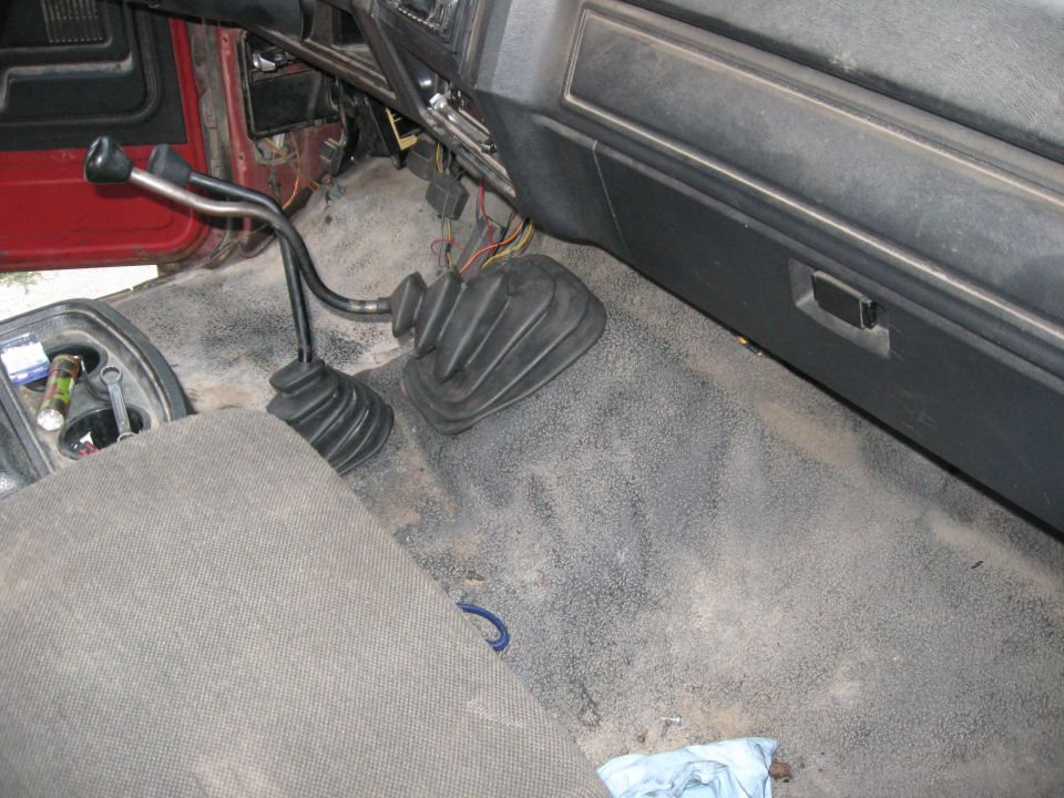 I trimmed the back end of the truck mat and the front of the Bronco mat so that they'd meet right in front of the seats.  It went in really well and is in MUCH better shape than the rotted Bronco mat.

Shifters are in!  Feels good having the interior look closer to a finished truck.