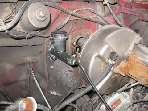 1981 Ford Bronco - I needed to move the brake booster out of the way to get the drill in. A circular metal saw drill bit worked perfectly and cut right throug…