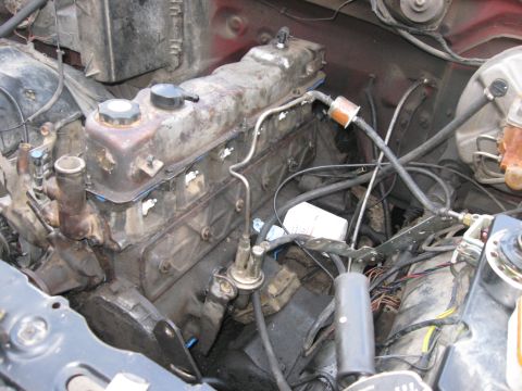 1981 Ford Bronco - Close-up view of a vehicle's engine compartment, showing various components and wiring.