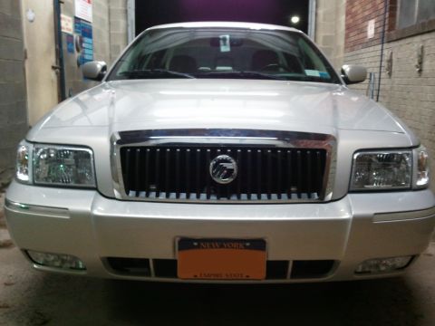 2008 Mercury Grand Marquis - Front view of a silver 2008 Mercury Grand Marquis parked indoors.