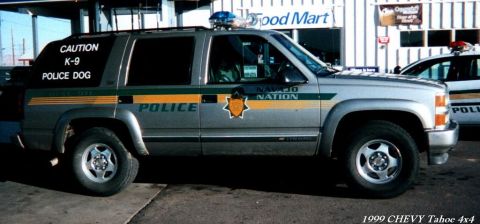 1991 Ford LTD Crown Victoria - Navajo Nation Police K-9 SUV with 'CAUTION K-9 POLICE DOG' on the rear window.