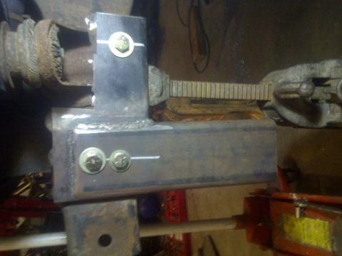 1995 Ford Bronco - Custom suspension bracket welded to axle housing, likely for off-road modification.