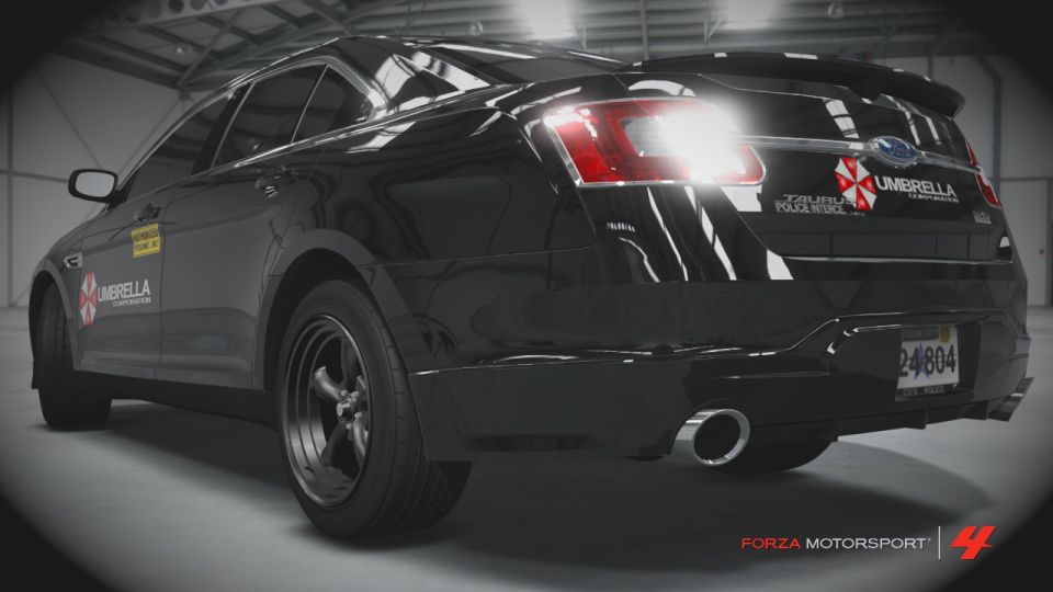 Black sedan with Umbrella Corporation and RPD livery, rear view. License plate 24804