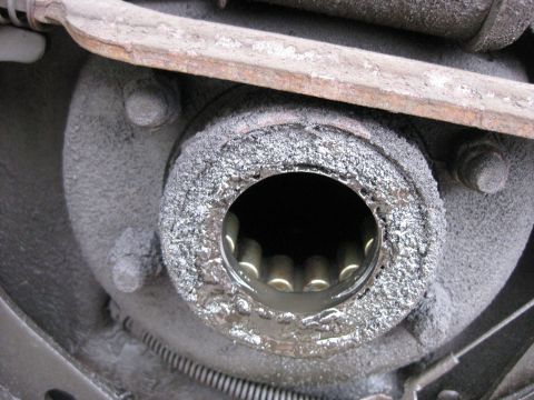 1994 Ford Bronco - Close-up of a vehicle's rear axle hub, showing internal splines and grease.