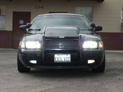 2003 Ford Crown Victoria - Close head-on shot of the EVIL VIC Crown Victoria showing fog lights, billet grille and push bar.