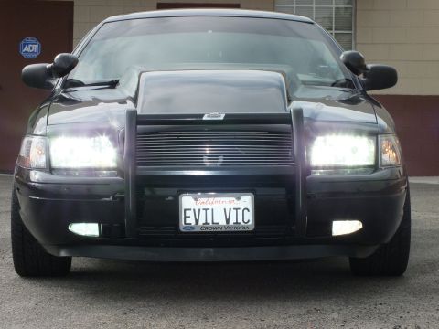 2003 Ford Crown Victoria - All lit up, the modified Crown Victoria displays a Ford-badged EVIL VIC California plate.