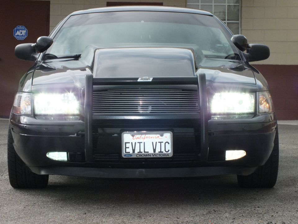Black Crown Victoria nose with headlights, fog lamps and EVIL VIC plate framed by CROWN VICTORIA