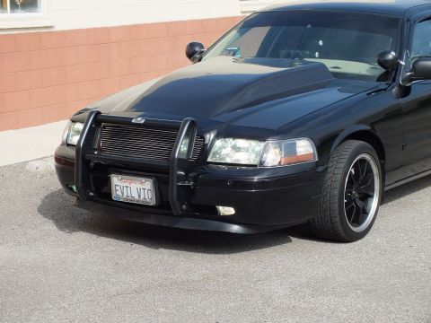 2003 Ford Crown Victoria - Front closeup of black Crown Victoria with grille guard, billet grille and EVIL VIC plate